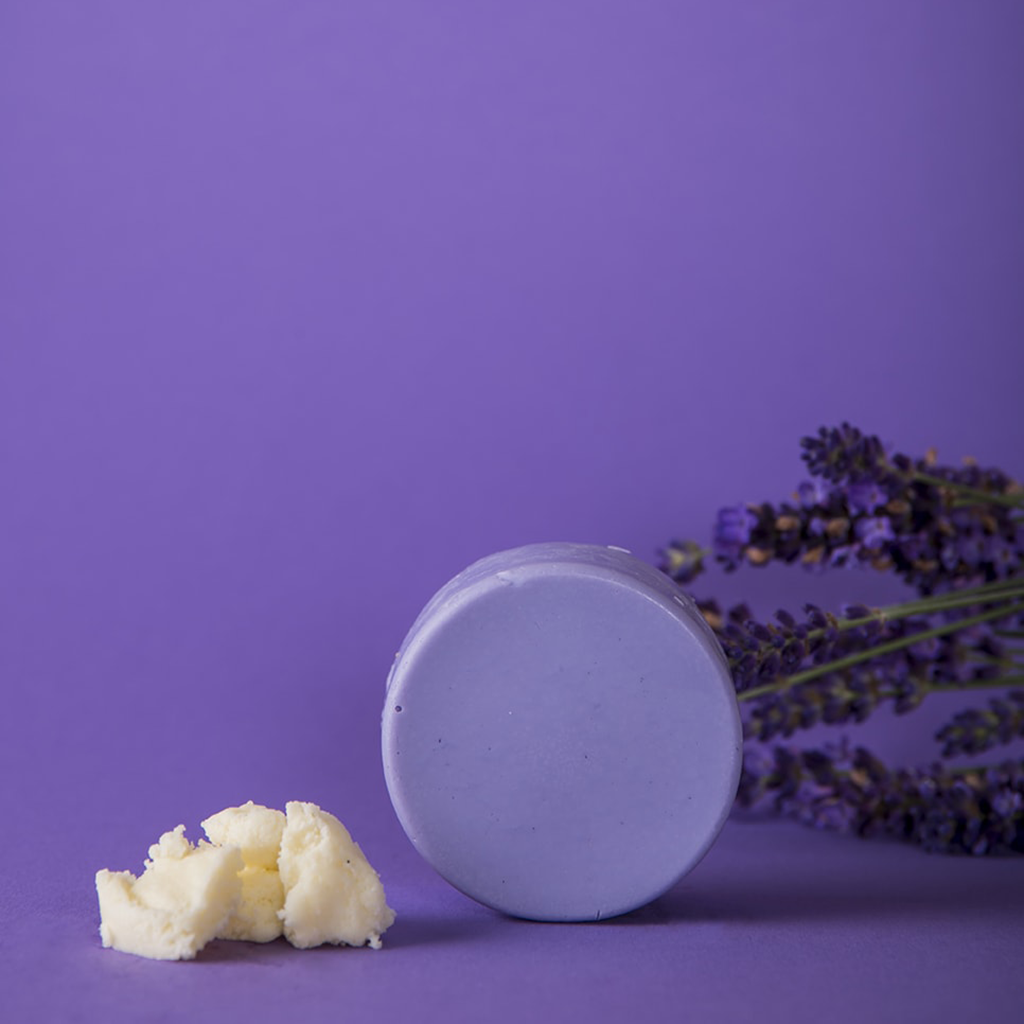 plastic-free and natural conditioner bar against yellow tones lavender bliss lavender plant